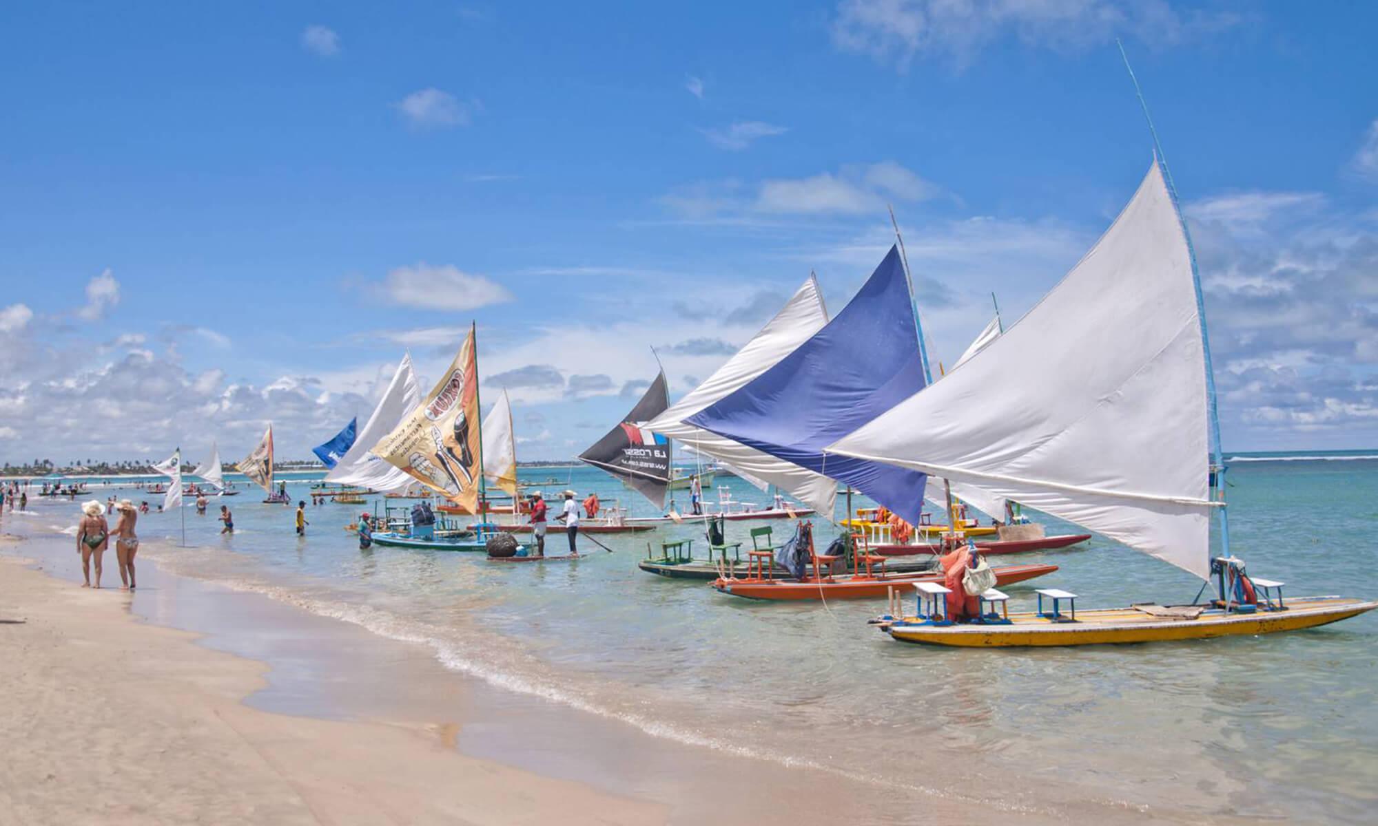 Some sailing boats can be seen here on the shore of Porto de Galinhas