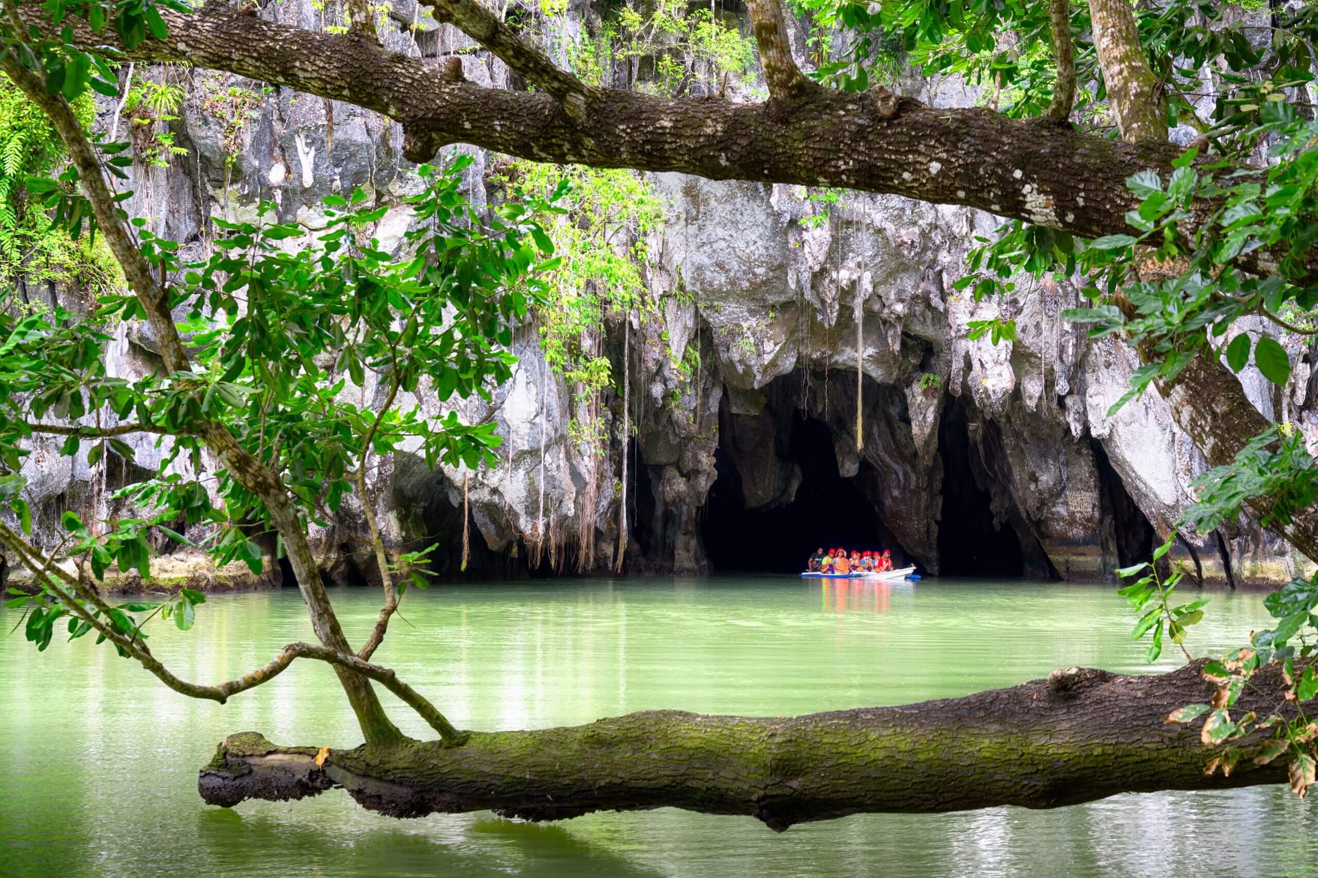 On a paddle boat, you can explore the UNESCO World Heritage Site Underground River in Puerto Princesa