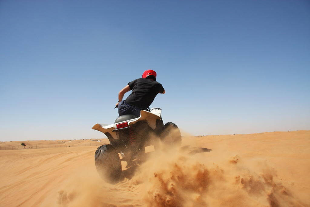Quad biking in the desert dunes is a lot of fun